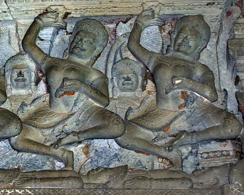 Two Tantric yogini dance upon corpses in a ritual at a Khmer temple in Pimai, Thailand.