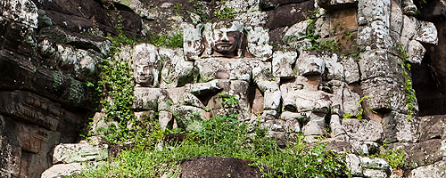 At the south gate entrance of Angkor Thom, the royal trio greets all visitors.