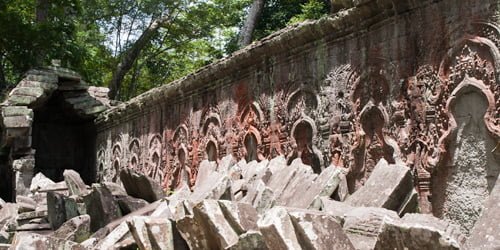 Each alcove originally held the Mahayana trinity in relief, but religious conflict caused them to be removed later.