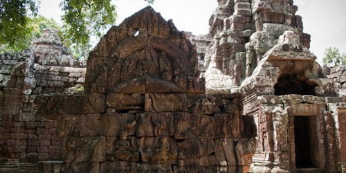 French conservators reconstructed a fallen pediment at Ta Som's entrance. The king, on the right, worshiped Avalokiteshvara.