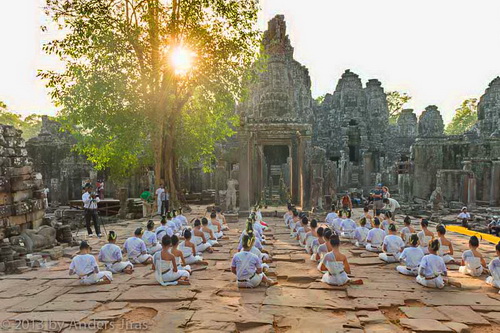 The NKFC Sacred Dancers of Angkor troupe performing a blessing ritual at Bayon temple in Angkor Thom. February 2013. Photo by Anders Jiras.