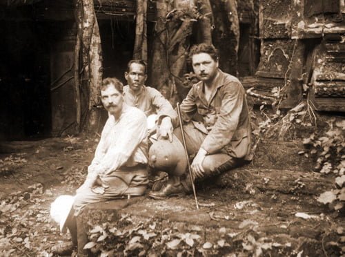 Henri Marchal, a Cambodian guide and George Groslier at Ta Prohm temple in Angkor, 1910.