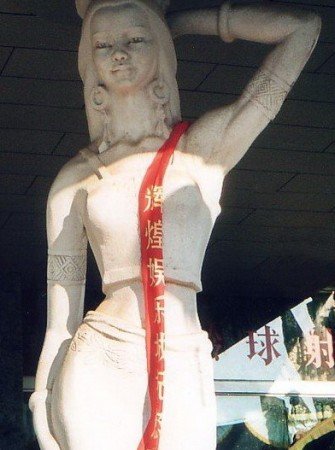This goddess greets visitors arriving to Xishuanbanna's Jinhong Airport. Her attributes relate to Khmer families discovered living in Southern China.