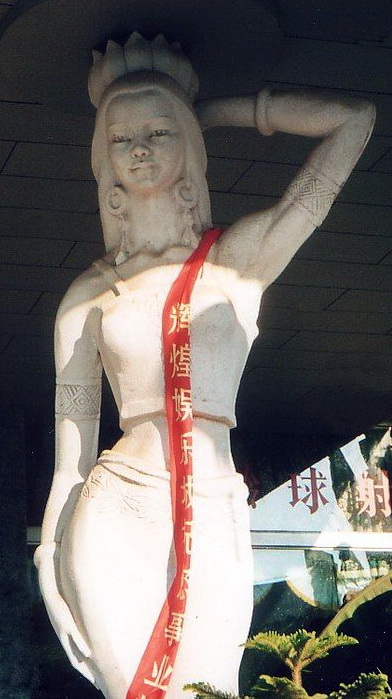 This goddess greets visitors arriving to Xishuanbanna's Jinhong Airport. Her attributes relate to Khmer families discovered living in Southern China.